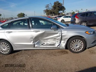 2014 Ford Fusion SE Hybrid with VIN 3FA6P0LU4ER206343, listed as a IAAI auction lot 41600260 with 198,834 mi miles and . Bid and sale history available at DreamBid. Image 6.