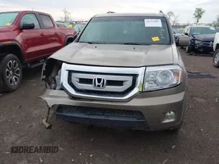 2011 Honda Pilot EX-L with VIN 5FNYF4H51BB076050, listed as a IAAI auction lot 42122883 with 143,288 mi miles and . Bid and sale history available at carsss.com. Image 13.