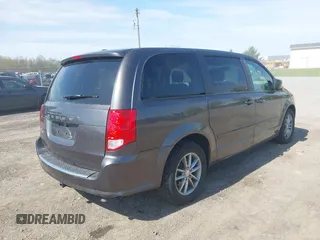 2015 Dodge Grand Caravan SE with VIN 2C4RDGBG2FR684367, listed as a IAAI auction lot 42167621 with 216,628 mi miles and . Bid and sale history available at DreamBid. Image 4.