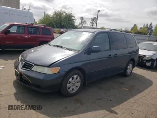 2003 Honda Odyssey EX-L z VIN 5FNRL18053B123100, wystawiony jako Copart lot #54159715 z przebiegiem 232 206 mil mil oraz Szkoda całkowita • Salvage title. Historia ofert i sprzedaży dostępna na DreamBid. Obrazek 1.