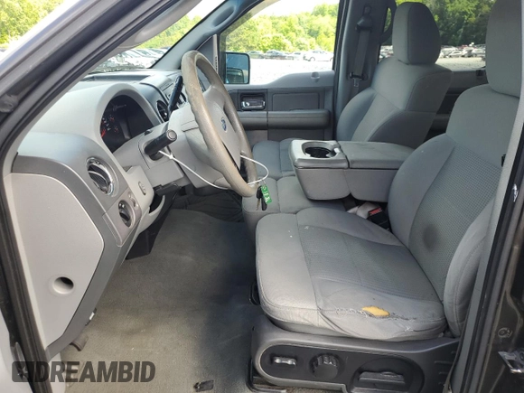 2007 Ford F-150 XLT with VIN 1FTRW12W47FA87342, listed as a Copart auction lot 56244265 with 293,800 mi miles and Salvage title. Bid and sale history available at DreamBid. Image 7.