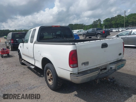 2003 Ford F-150 XL with VIN 1FTRX17L93NB61902, listed as a IAAI auction lot 42096982 with 318,850 mi miles. Bid and sale history available at carsss.com. Image 3.