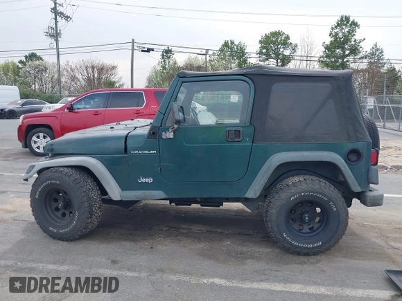 2000 Jeep Wrangler SE with VIN 1J4FA29P0YP728370, listed as a IAAI auction lot 41788463 with 186,995 mi miles. Bid and sale history available at carsss.com. Image 14.