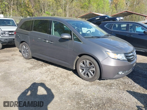 2015 Honda Odyssey Touring Elite with VIN 5FNRL5H99FB094727, listed as a IAAI auction lot 42001288 with 254,015 mi miles and . Bid and sale history available at DreamBid. Image 1.