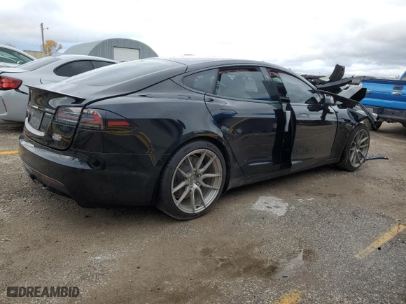 2022 Tesla Model S Plaid with VIN 5YJSA1E69NF477754, listed as a Copart auction lot 83974254 with 0 mi miles and Salvage Title. Bid and sale history available at carsss.com. Image 3.