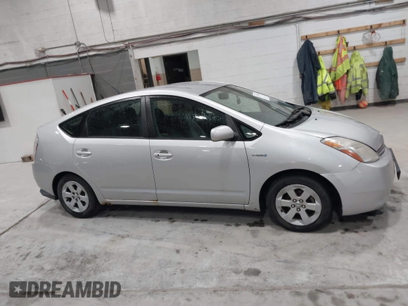 2007 Toyota Prius z VIN JTDKB20U977649489, wystawiony jako IAAI lot #41772600 z przebiegiem 248 525 mil mil oraz . Historia ofert i sprzedaży dostępna na DreamBid. Obrazek 13.