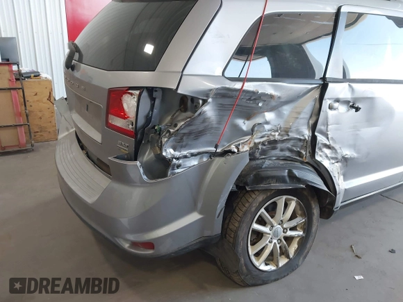 2015 Dodge Journey SXT z VIN 3C4PDCBG1FT587061, wystawiony jako IAAI lot #42186693 z przebiegiem 186 551 mil mil oraz . Historia ofert i sprzedaży dostępna na DreamBid. Obrazek 6.
