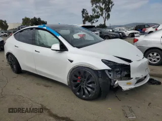 2022 Tesla Model Y Performance with VIN 7SAYGDEF1NF410241, listed as a Copart auction lot 45017155 with 42,652 mi miles and Salvage Title. Bid and sale history available at DreamBid. Image 4.