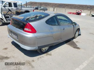 2000 Honda Insight z VIN JHMZE1357YT003654, wystawiony jako IAAI lot #42428076 z przebiegiem 173 445 mil mil oraz . Historia ofert i sprzedaży dostępna na DreamBid. Obrazek 4.