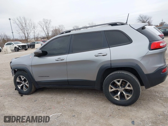 2016 Jeep Cherokee Trailhawk with VIN 1C4PJMBS7GW192574, listed as a IAAI auction lot 41986638 with 144,970 mi miles and . Bid and sale history available at DreamBid. Image 14.