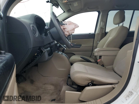 2014 Jeep Compass Sport with VIN 1C4NJCBA5ED844934, listed as a Copart auction lot 52774945 with 148,897 mi miles and Salvage Title. Bid and sale history available at carsss.com. Image 7.