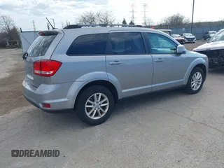 2017 Dodge Journey SXT z VIN 3C4PDDBG6HT595309, wystawiony jako IAAI lot #41918029 z przebiegiem 127 247 mil mil oraz . Historia ofert i sprzedaży dostępna na DreamBid. Obrazek 4.