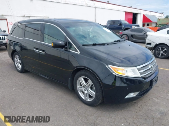 2012 Honda Odyssey Touring with VIN 5FNRL5H93CB121190, listed as a IAAI auction lot 42223998 with 154,358 mi miles and . Bid and sale history available at DreamBid. Image 1.
