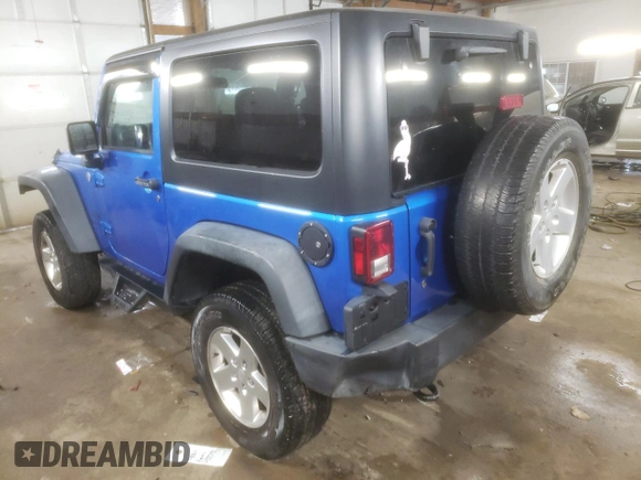 2015 Jeep Wrangler Willys Wheeler with VIN 1C4AJWAG2FL568130, listed as a Copart auction lot 80682914 with 111,686 mi miles and Salvage title. Bid and sale history available at DreamBid. Image 2.