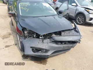 2015 Ford Focus SE z VIN 1FADP3K21FL254875, wystawiony jako IAAI lot #42403064 z przebiegiem 140 198 mil mil oraz . Historia ofert i sprzedaży dostępna na DreamBid. Obrazek 6.
