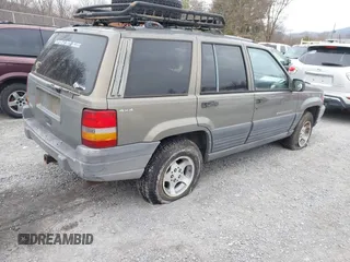 1996 Jeep Grand Cherokee with VIN 1J4EZ58S1TC112995, listed as a IAAI auction lot 41706966 with 356,727 mi miles and . Bid and sale history available at DreamBid. Image 4.