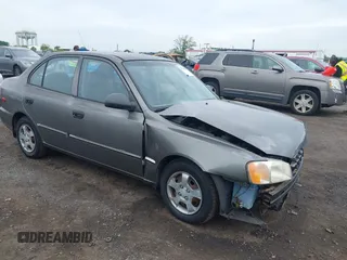 2002 Hyundai Accent GL z VIN KMHCG45C52U372587, wystawiony jako IAAI lot #42244428 z przebiegiem 43 538 mil mil oraz . Historia ofert i sprzedaży dostępna na DreamBid. Obrazek 1.