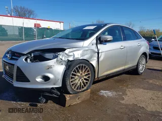 2014 Ford Focus Titanium with VIN 1FADP3J28EL354505, listed as a IAAI auction lot 42025966 with 104,868 mi miles. Bid and sale history available at carsss.com. Image 6.