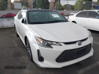 2016 Scion tC with VIN JTKJF5C75GJ014448, listed as a IAAI auction lot 41755541 with 60,571 mi miles. Bid and sale history available at carsss.com. Image 1.