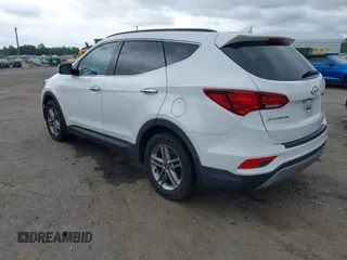 2018 Hyundai Santa Fe 2.4L z VIN 5XYZUDLB1JG543837, wystawiony jako IAAI lot #42235471 z przebiegiem 157 909 mil mil oraz . Historia ofert i sprzedaży dostępna na DreamBid. Obrazek 3.