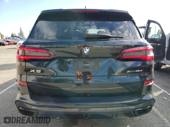 2021 BMW X5 xDrive45e with VIN 5UXTA6C03M9H56515, listed as a Copart auction lot 45798715 with 59,156 mi miles and Salvage Title. Bid and sale history available at carsss.com. Image 6.
