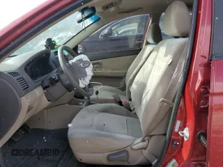 2009 Kia Spectra SX with VIN KNAFE222495661159, listed as a Copart auction lot 42604295 with 123,934 mi miles and Salvage Title. Bid and sale history available at carsss.com. Image 7.