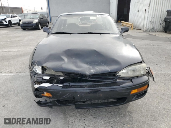 1995 Toyota Camry LE with VIN JT2GK12E2S0079545, listed as a Copart auction lot 84058164 with 150,539 mi miles and Salvage Title. Bid and sale history available at carsss.com. Image 5.