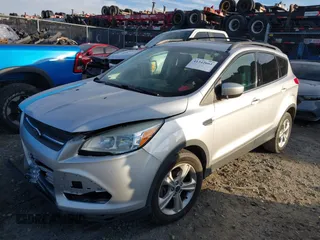 2014 Ford Escape SE with VIN 1FMCU9G96EUC53975, listed as a IAAI auction lot 41342661 with 128,594 mi miles. Bid and sale history available at carsss.com. Image 17.