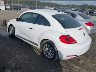 2016 Volkswagen Beetle Coupe 1.8T Wolfsburg Edition with VIN 3VWF17AT0GM607755, listed as a IAAI auction lot 41508585 with 52,913 mi miles. Bid and sale history available at carsss.com. Image 3.