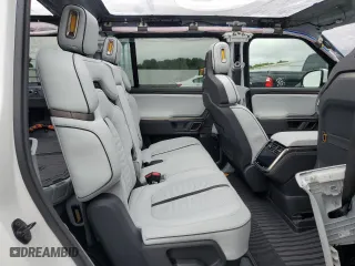 2023 Rivian R1S Adventure with VIN 7PDSGABA6PN017889, listed as a Copart auction lot 68860864 with 7,661 mi miles and Salvage Title. Bid and sale history available at carsss.com. Image 11.