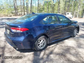 2021 Toyota Corolla Hybrid LE with VIN JTDEAMDE9MJ008582, listed as a IAAI auction lot 41998098 with 113,863 mi miles. Bid and sale history available at carsss.com. Image 4.