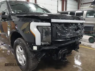 2023 Ford F-150 Lightning Pro with VIN 1FTVW1EV5PWG59228, listed as a IAAI auction lot 40838790 with Not Provided miles and . Bid and sale history available at DreamBid. Image 20.