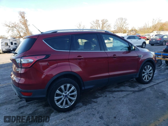2017 Ford Escape Titanium with VIN 1FMCU0JD7HUD41107, listed as a Copart auction lot 85657084 with 197,982 mi miles and Salvage Title. Bid and sale history available at DreamBid. Image 3.