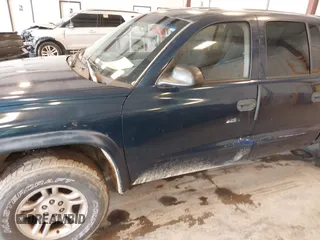 2003 Dodge Dakota SLT with VIN 1D7HL48N63S177233, listed as a IAAI auction lot 42167711 with 163,511 mi miles and . Bid and sale history available at carsss.com. Image 6.
