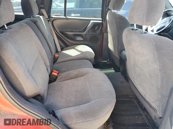 1999 Jeep Grand Cherokee Laredo z VIN 1J4G258SXXC518308, wystawiony jako Copart lot #56636235 z przebiegiem 233 649 mil mil oraz Szkoda całkowita • Salvage title. Historia ofert i sprzedaży dostępna na DreamBid. Obrazek 11.