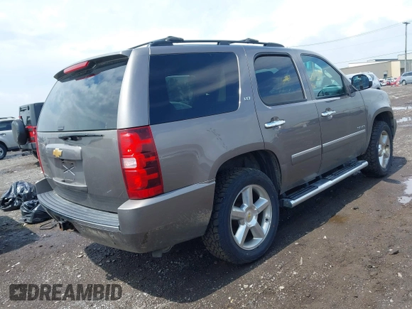 2013 Chevrolet Tahoe LTZ with VIN 1GNSKCE0XDR373858, listed as a IAAI auction lot 42456875 with 297,084 mi miles and . Bid and sale history available at DreamBid. Image 4.