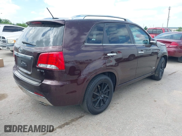 2012 Kia Sorento SX with VIN 5XYKWDA25CG249584, listed as a IAAI auction lot 42008349 with 214,381 mi miles. Bid and sale history available at carsss.com. Image 4.