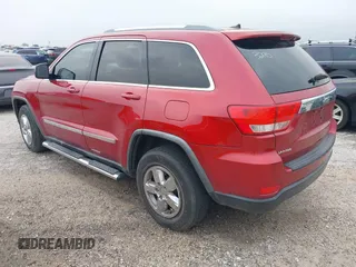 2011 Jeep Grand Cherokee Laredo with VIN 1J4RS4GG1BC673290, listed as a IAAI auction lot 42042557 with 147,590 mi miles and . Bid and sale history available at DreamBid. Image 3.
