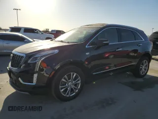 2021 Cadillac XT5 FWD Premium Luxury with VIN 1GYKNCRS5MZ138712, listed as a Copart auction lot 49697945 with 54,893 mi miles and Salvage Title. Bid and sale history available at carsss.com. Image 1.