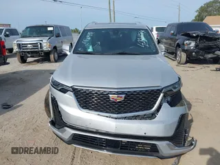 2020 Cadillac XT6 FWD Premium Luxury z VIN 1GYKPCRSXLZ136057, wystawiony jako IAAI lot #42211514 z przebiegiem 32 476 mil mil oraz . Historia ofert i sprzedaży dostępna na DreamBid. Obrazek 12.