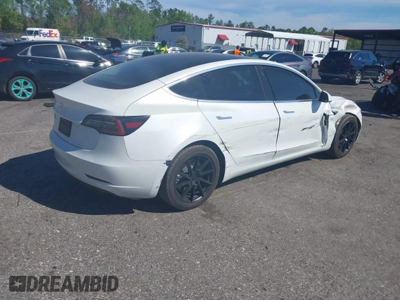 2019 Tesla Model 3 Mid Range with VIN 5YJ3E1EA7KF425127, listed as a IAAI auction lot 41886436 with 87,236 mi miles and . Bid and sale history available at carsss.com. Image 4.