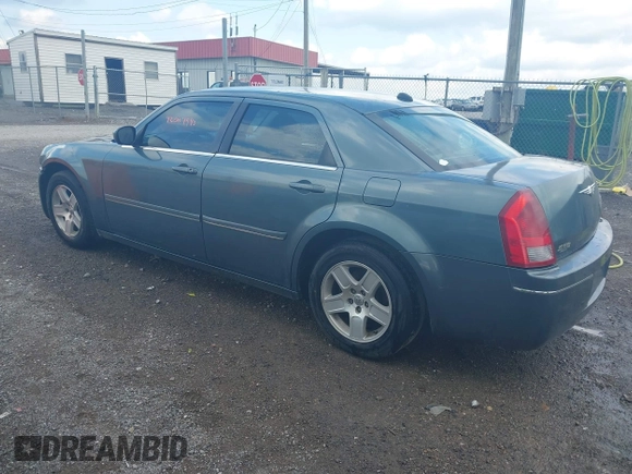 2005 Chrysler 300 with VIN 2C3AA53G55H186617, listed as a IAAI auction lot 42004943 with 230,956 mi miles. Bid and sale history available at carsss.com. Image 3.