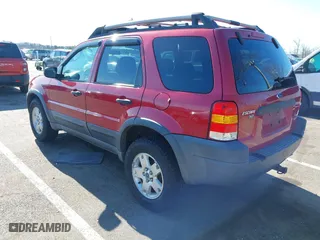 2003 Ford Escape XLT Popular 2 with VIN 1FMCU93183KC65571, listed as a IAAI auction lot 41768982 with 150,658 mi miles. Bid and sale history available at carsss.com. Image 3.