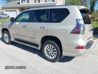 2014 Lexus GX with VIN JTJBM7FX7E5068037, listed as a IAAI auction lot 42069809 with 120,791 mi miles. Bid and sale history available at carsss.com. Image 3.