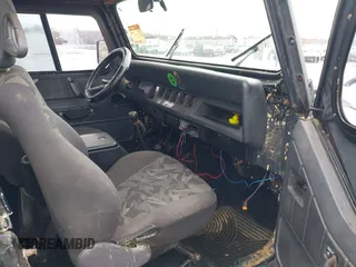 1995 Jeep Wrangler S with VIN 1J4FY19P0SP258399, listed as a IAAI auction lot 41970320 with 151,621 mi miles. Bid and sale history available at carsss.com. Image 5.