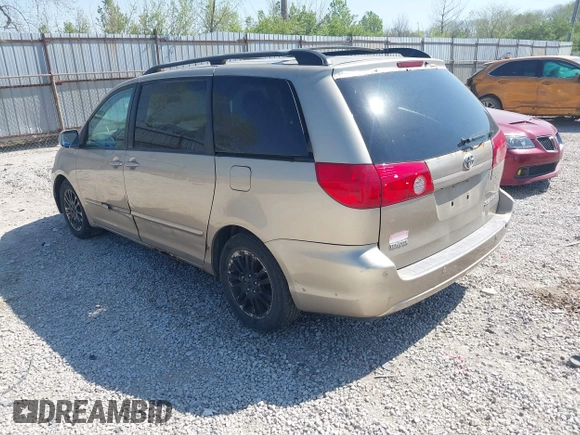 2009 Toyota Sienna XLE with VIN 5TDZK22CX9S257522, listed as a IAAI auction lot 42113875 with 214,873 mi miles. Bid and sale history available at carsss.com. Image 3.