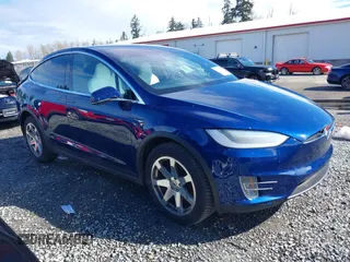 2018 Tesla Model X 75D with VIN 5YJXCBE24JF090395, listed as a IAAI auction lot 41888956 with 89,394 mi miles. Bid and sale history available at carsss.com. Image 1.