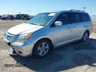 2010 Honda Odyssey Touring with VIN 5FNRL3H97AB015472, listed as a IAAI auction lot 41763680 with 144,309 mi miles. Bid and sale history available at carsss.com. Image 2.