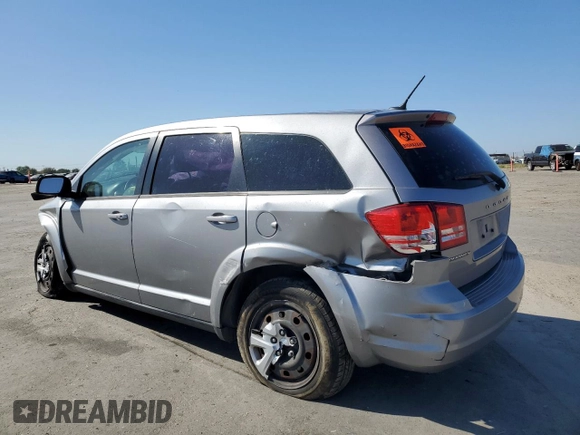 2015 Dodge Journey American Value with VIN 3C4PDCABXFT712192, listed as a Copart auction lot 55680975 with 104,579 mi miles and Salvage Title. Bid and sale history available at DreamBid. Image 2.