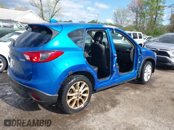 2013 Mazda CX-5 Grand Touring with VIN JM3KE4DE4D0123837, listed as a IAAI auction lot 42031074 with 121,818 mi miles. Bid and sale history available at carsss.com. Image 4.